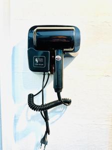 a black phone is attached to a wall at Lanta L.D. Beach Bungalow in Ko Lanta