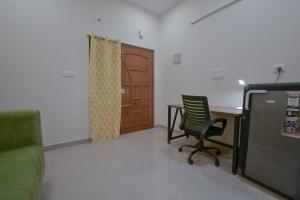 an office with a chair and a desk and a door at HomeSlice Manzil - 1BHK in HSR in Bangalore
