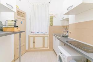a small kitchen with a counter and a sink at Plage des catalans appart 4 personnes in Marseille
