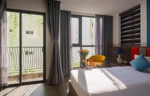 Postel nebo postele na pokoji v ubytování Aaron Boutique Hotel