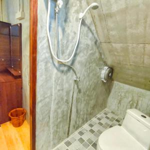 a shower stall in a bathroom with a toilet at Poohry Seaview in Ko Lanta