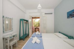 Ένα ή περισσότερα κρεβάτια σε δωμάτιο στο Villa Areti