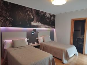Postel nebo postele na pokoji v ubytování Hello Villarreal Suites