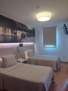 Postel nebo postele na pokoji v ubytování Hello Villarreal Suites