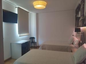 Postel nebo postele na pokoji v ubytování Hello Villarreal Suites