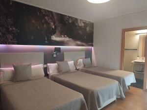 Postel nebo postele na pokoji v ubytování Hello Villarreal Suites