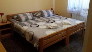 Posteľ alebo postele v izbe v ubytovaní Plitvice Rooms Family Glumac
