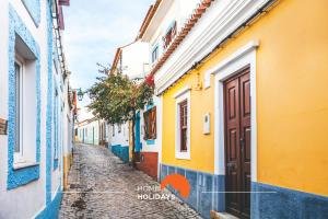 an alley in positano with colorful houses at #002 Apartment in the center of the City in Albufeira