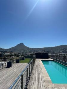 a swimming pool on the roof of a building at Modern Apartment in Chapel Towers in Cape Town