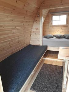 Кровать или кровати в номере Fossatun Camping Pods & Cottages - Sleeping Bag Accommodation