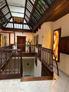 a building with stairs and a stained glass ceiling at Luna Apartments in Krakow