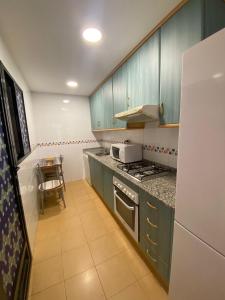 A kitchen or kitchenette at Playa Paraiso 27E