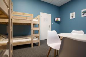 Posteľ alebo postele v izbe v ubytovaní Moon Hostel Wrocław