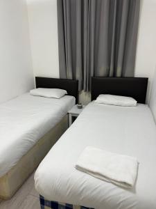 Cama o camas de una habitación en Miles building 2
