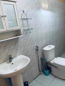 Ванная комната в Idéal et meilleur Appart du coin Guediawaye