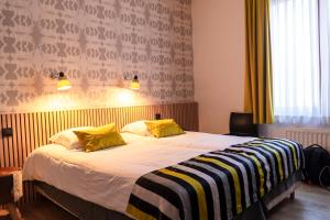 Giường trong phòng chung tại Hotel d'Alcantara