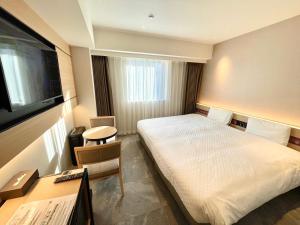 Cama ou camas em um quarto em Henn na Hotel Premier Nara