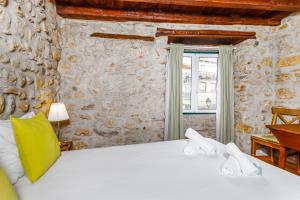 Llit o llits en una habitació de Medieval Apartament Alfama-Center