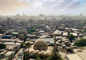 an aerial view of a city with a mosque at The St. Regis Cairo in Cairo