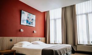 Giường trong phòng chung tại Hotel d'Alcantara