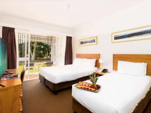Postelja oz. postelje v sobi nastanitve Novotel Sunshine Coast Resort