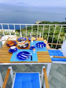 a table on a cruise ship with food on it at B&B La Danza del Mare in Anacapri