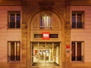 a store front of a building with a ups sign at ibis Paris Gare de Lyon Ledru Rollin in Paris