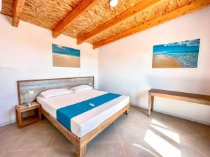 Postel nebo postele na pokoji v ubytování Halos Casa Resort + 37 fotografií