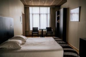 Giường trong phòng chung tại Hotel d'Alcantara