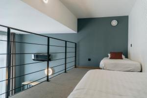 Giường trong phòng chung tại Hotel d'Alcantara