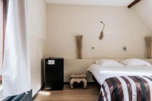 Giường trong phòng chung tại Hotel d'Alcantara