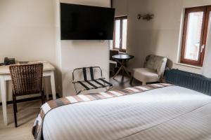 Giường trong phòng chung tại Hotel d'Alcantara