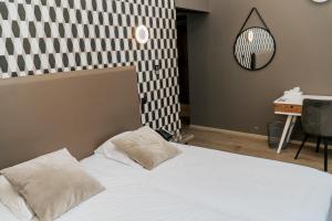 Giường trong phòng chung tại Hotel d'Alcantara
