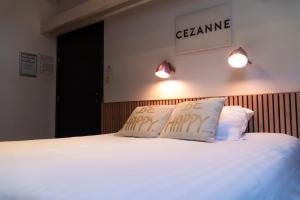 Giường trong phòng chung tại Hotel d'Alcantara
