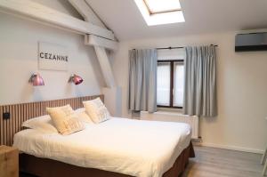 Giường trong phòng chung tại Hotel d'Alcantara