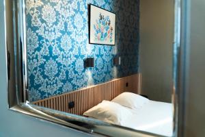 Giường trong phòng chung tại Hotel d'Alcantara