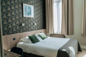 Giường trong phòng chung tại Hotel d'Alcantara