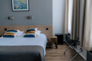 Giường trong phòng chung tại Hotel d'Alcantara