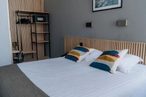 Giường trong phòng chung tại Hotel d'Alcantara