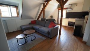 a living room with a couch and a table at Haus Onel in Schmallenberg