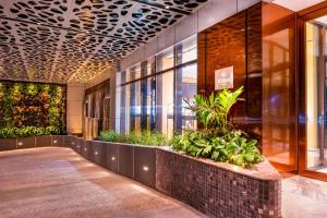 a lobby of a building with plants at Hilton Kinshasa in Kinshasa