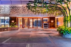 an empty lobby of a building with glass doors at Hilton Kinshasa in Kinshasa