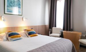 Giường trong phòng chung tại Hotel d'Alcantara