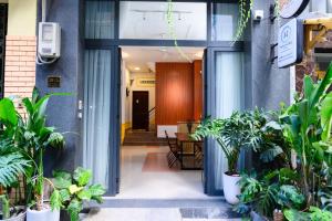 an entrance to a building with plants at Van Hung in Ho Chi Minh City