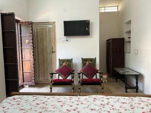 TV i/ili zabavni centar u objektu Ashraya home stay in Pushkar valley
