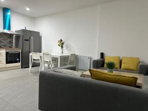 a living room with a couch and a table at Cork city En-suite Single room in Cork