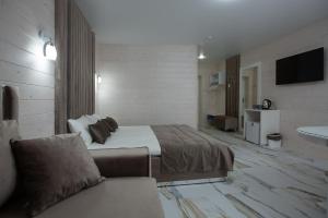 Postel nebo postele na pokoji v ubytování Milana SPA & Hotel - SPA included