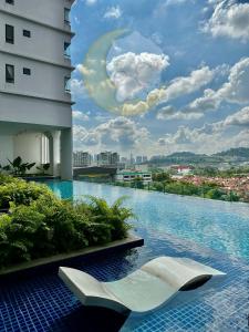 a swimming pool with a moon on a building at NEW Cozy Menjalara 5mins to DesaParkCity 2Rooms in Kuala Lumpur