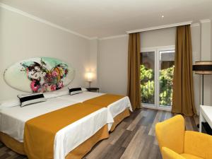 Postel nebo postele na pokoji v ubytování Hotel Altos de Istán