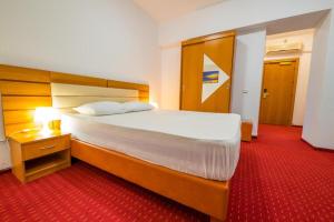 Postel nebo postele na pokoji v ubytování Hotel Sir Orhideea